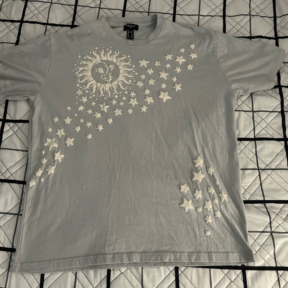 Greyish, green, blue color tee